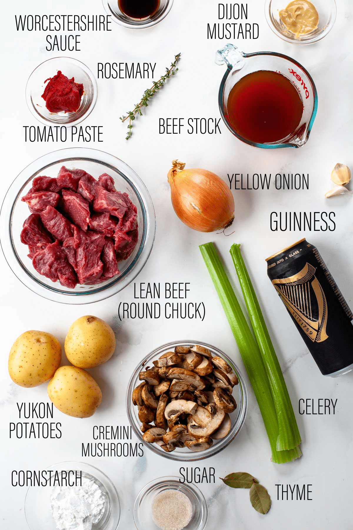 Ingredients shown. Rosemary, dijon mustard, worcestershire sauce, beef stock, tomato paste, yellow onion, guinness, lean beef, yukon potatoes, cremini mushrooms, celery, thyme, sugar, cornstarch